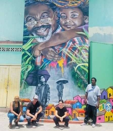 Mural by artists Benjamin Swatez and Azerine DeLuca, and local artists Lee-Andra, David, Abbott and Storm, painted in the wake of the La Soufriere volcano eruption on the island of St. Vincent in 2021. Ministry of National Mobilization, SVG